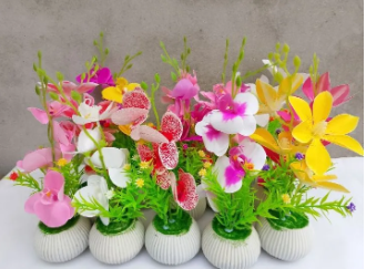 Elevate your interior decor with this Artificial Orchid Floral Arrangement, perfect for adding a touch of natural grace and vibrant color to any room. Nestled in a stylish decorative pot, this lifelike plant features vivid purple orchid blooms, rich green